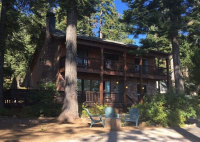 Photo of the cabin with chairs out front